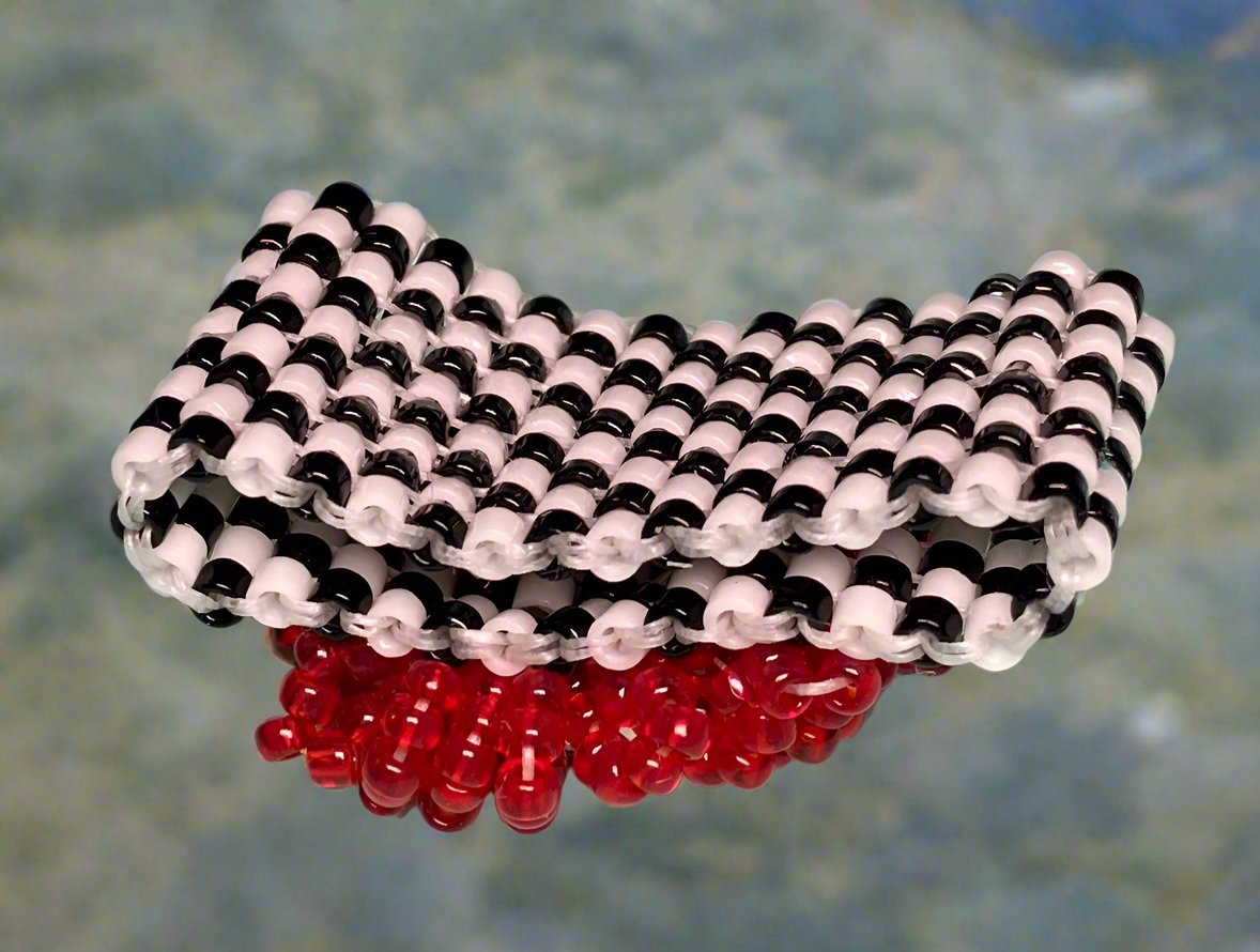 Red Triangle Crystal on a Black and White Ring