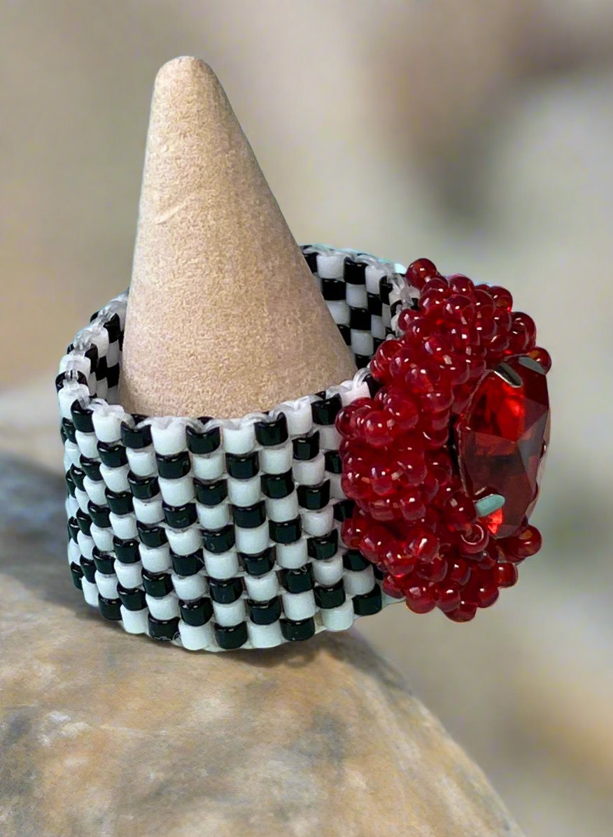 Red Triangle Crystal on a Black and White Ring