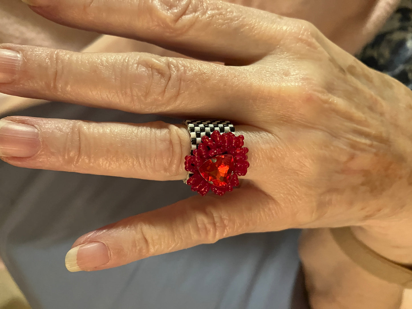 Red Triangle Crystal on a Black and White Ring